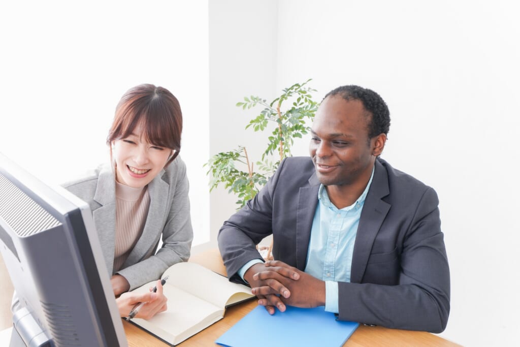 Japanese woman helping a foreigner man