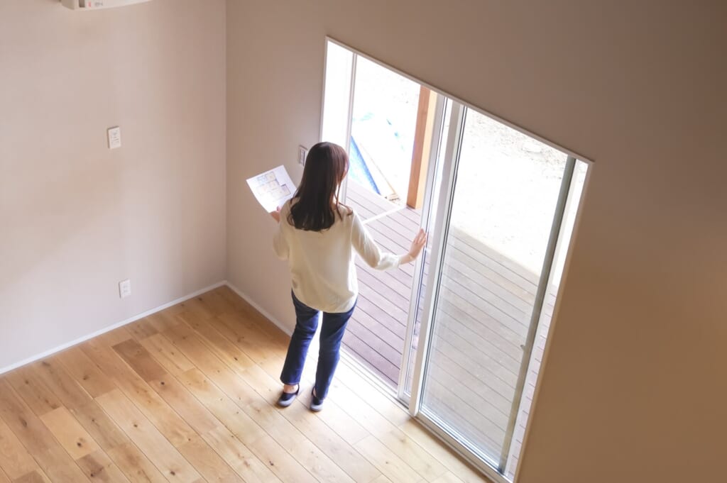 Woman check apartment after real estate transaction