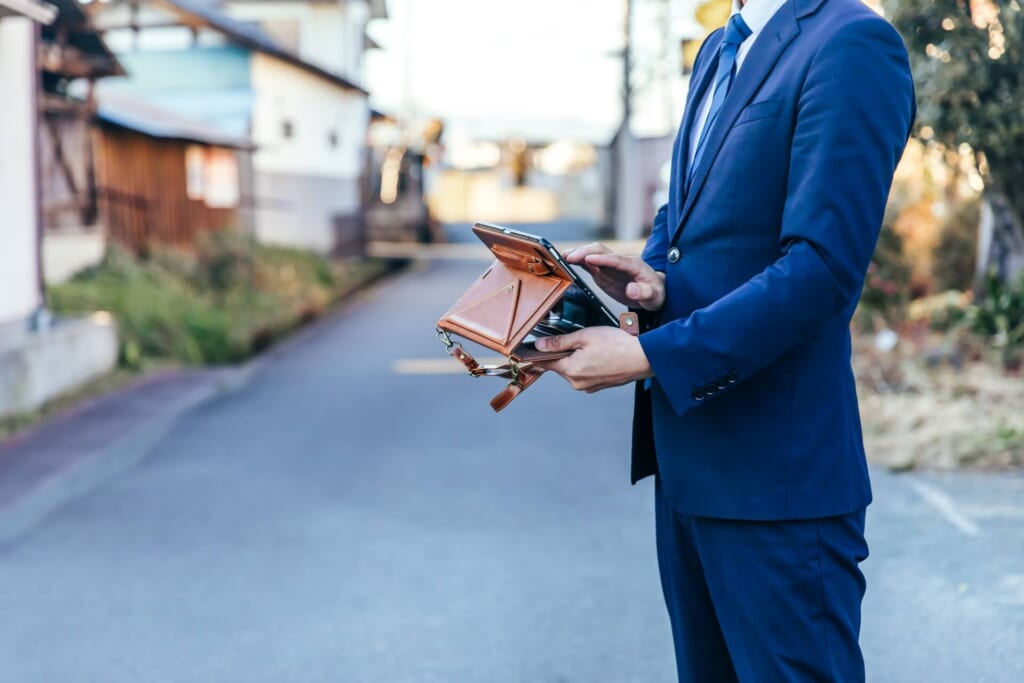 Real estate employee in a rural street